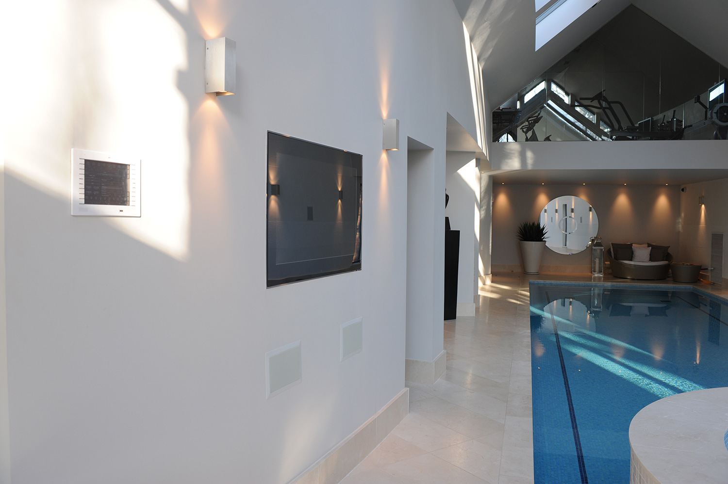 Plasma screen by indoor swimming pool